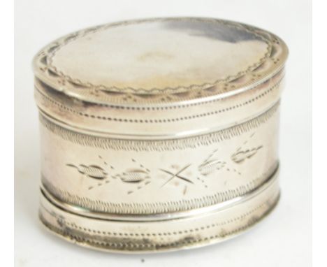 A George III hallmarked silver oval nutmeg grater with bright cut decoration to the main body and two detachable lids to both