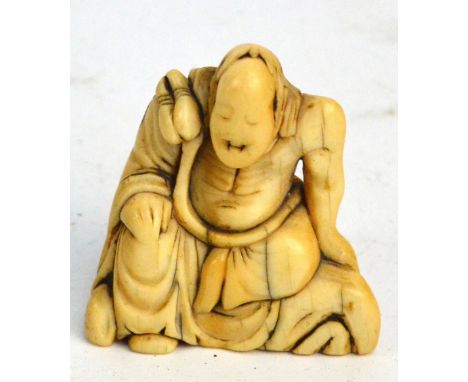 A 19th century Japanese carved ivory netsuke in the form of a seated elder, height 4cm. CONDITION REPORT: The figure is very 