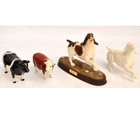 Four Beswick figures; "Hereford Cow", model no.1360, Friesian Bull "CH. Coddington Hilt Bar", model no.14398, "Spaniel" - on 