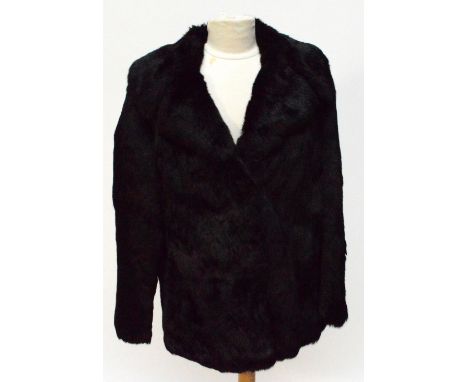 A vintage coney fur jacket with original receipt.