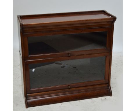 A walnut Globe Wernicke style two tiered stacking bookcase, width 87cm.
