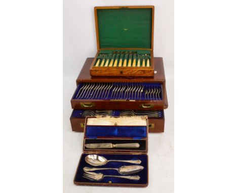 A large cased twelve setting canteen of cutlery with two drawers and brass handles, comprising dinner forks and spoons, desse