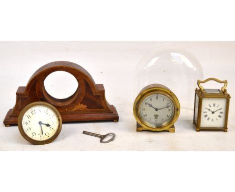 A c.1930's brass cased car clock, the circular dial set with Arabic numerals, stamped "Smith's MA London, reg 155282", diamet