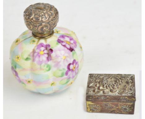 An Edward VII hallmarked silver topped Japanese porcelain scent bottle of globular fluted form, painted with floral sprays, L
