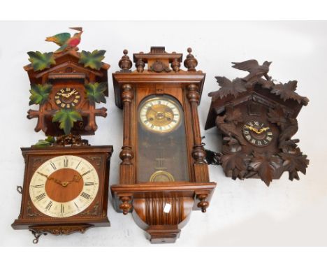 A Vienna style eight day wall clock, the circular dial set with Roman numerals, height 65cm, two cuckoo clocks and another we