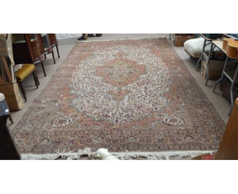 An Indian floral decorated carpet.