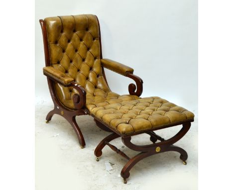 A Victorian mahogany framed and button leather upholstered gentleman's scroll back armchair, raised on square section outswep