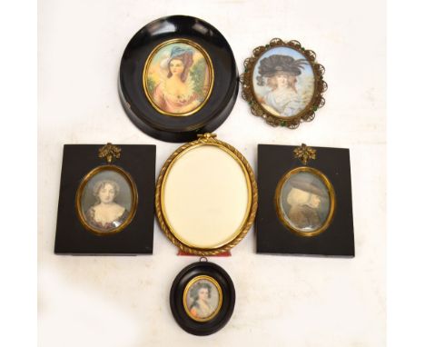 After GREUZE; an oval miniature portrait of a woman wearing a hat, bearing signature to lower right, in base metal wire frame