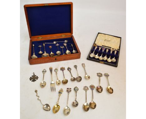A collection of various hallmarked silver enamel decorated souvenir armorial spoons, including "London", Robert Pringle & Son