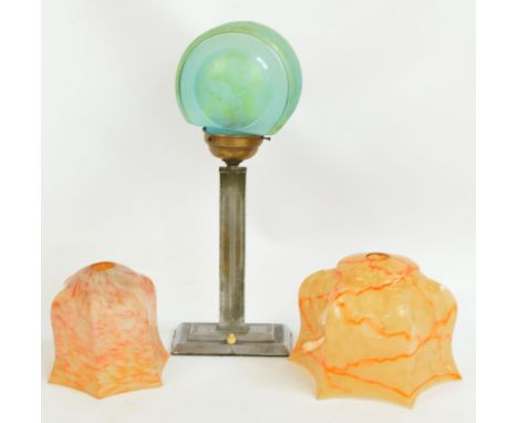 An Art Deco chrome table lamp with green tinted glass shade, height 47cm, and two mottled glass lamp shades (3).