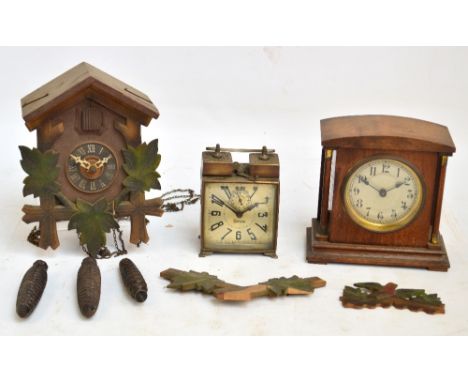 An unusual mid 1930's Art Deco German metal alarm clock, the square face set with stylised Arabic numerals and pentagonal sub