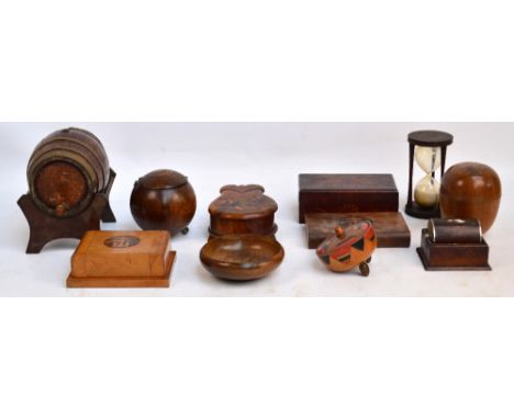 A quantity of treen including a owl on stand, a propelling cigarette dispenser, a further cigarette dispenser, an hour glass,