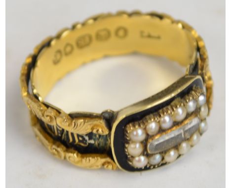 An 1830s 18ct yellow gold mourning ring, set with hair buckle compartment within a pearl border on black enamel background, t