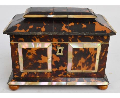 A mid 19th century tortoiseshell and mother of pearl inlaid sarcophagus tea caddy, with two section interior (one lid missing