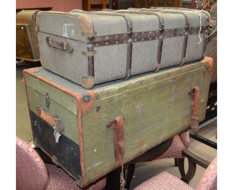 A vintage canvas and leatherbound travelling trunk with initials SRV to one side and with old labels, 46 x 53 x 104cm, and a 