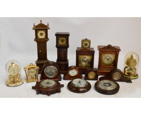 A collection of various predominantly oak cased clocks, including three domed clocks of small proportions, two examples model