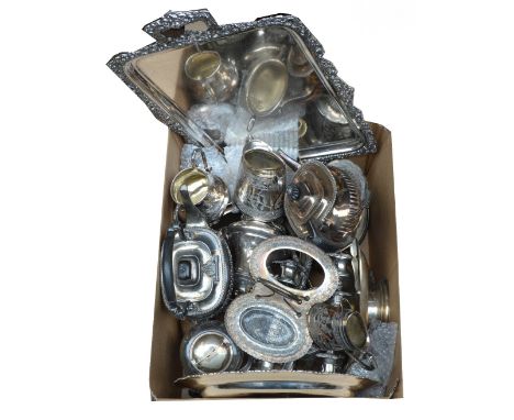 A large quantity of electroplated items including a large twin handled tray, a three piece tea service, a pair of candlestick