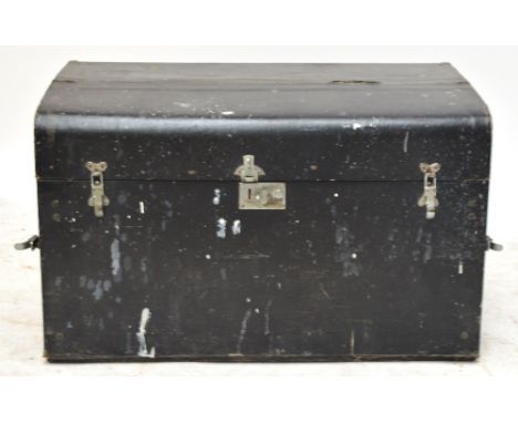 A vintage trunk including a quantity of tools including ten wooden planes and two steel planes.
