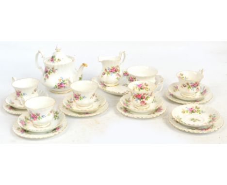 A Royal Albert "Moss Rose" pattern part tea service comprising teapot, sugar bowl, cream jug, sandwich plate and six trios (o