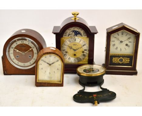 A German reproduction mahogany veneered bracket clock with dome top, the circular dial set with Roman numerals and moon phase
