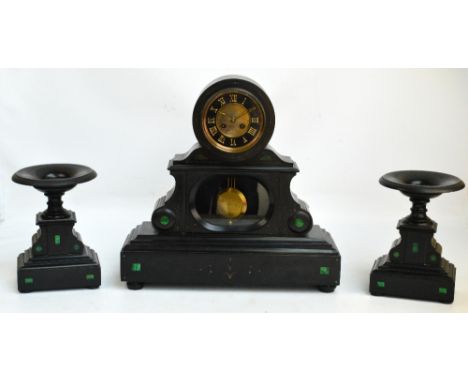 A large late 19th century French black slate three piece clock garniture, the circular dial set with Roman numerals, the eigh