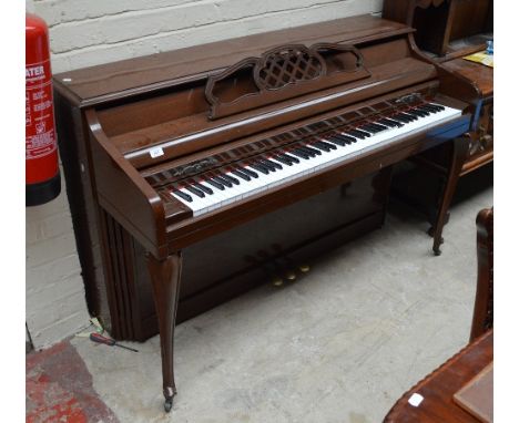 A modern lacquered upright piano with cabriole front legs, bearing labels for "Kimball" and "Artist Spinet", width 144cm.