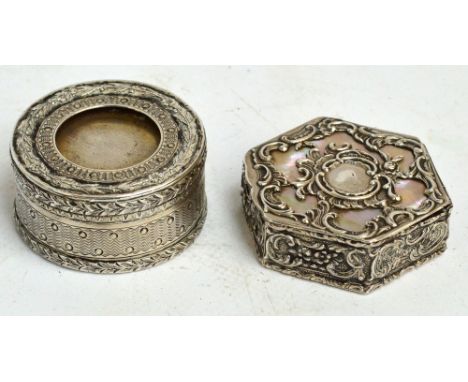 A late 19th/early 20th century German pill box of hexagonal form, overall embossed with foliate scrolls and with mother of pe
