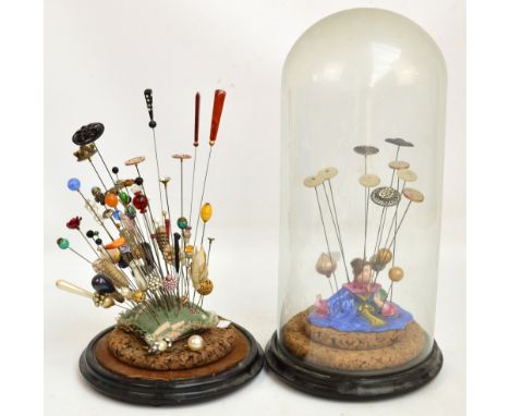 A large quantity of vintage hat pins including jet examples, micromosaic, button examples, etc, contained within a dome in a 