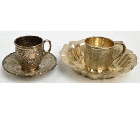 A George V hallmarked silver christening mug with overall engine turned decoration, centred with circular vacant cartouche, w