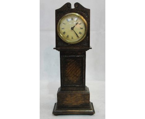 A miniature longcase clock in oak case with crossed arrow mark to dial and movement