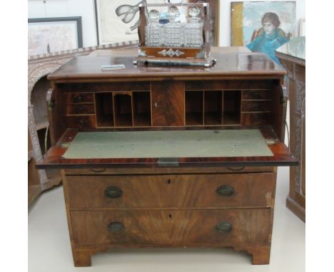 A 19th century mahogany secretaire on wide bracket feet