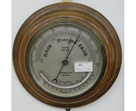 A wall barometer having a silver dial by John Barker & Co Ltd of Kensington