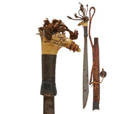 dating: 19th Century provenance: Kalimantan, Solid, single-edged blade, flat at the right side. Richly sculpted, bone hilt de