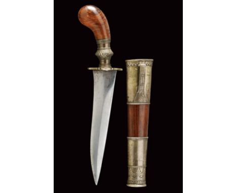 dating: 20th Century provenance: Indonesia, Solid, wide, double-edged blade ribbed at the center; wooden hilt with richly-eng