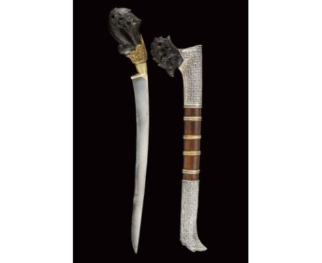 dating: End of 19th beginning of 20th Century provenance: Sumatra, Curved, single-edged blade. Short horn hilt carved with fl