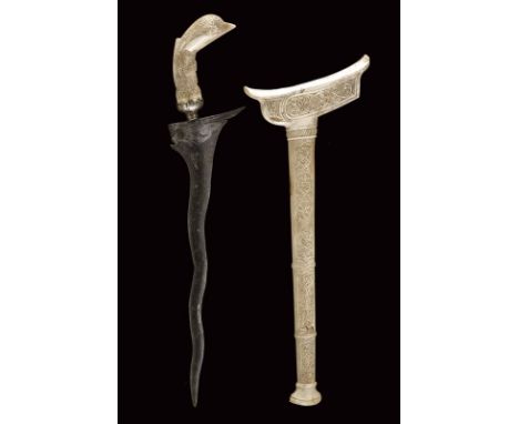 dating: circa 1900 provenance: Sumatra, Undulated, double-edged blade with slightly carved base and with fuller; carved bone 