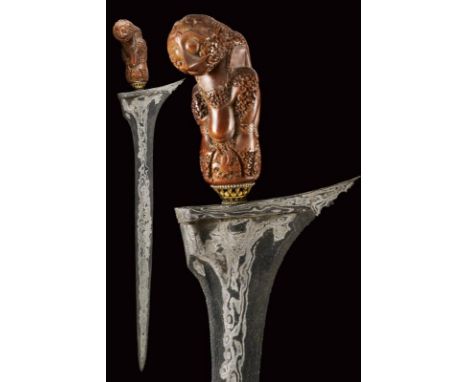 dating: early 20th Century provenance: Giava, Straight, smooth, double-edged blade made of fine pamor, the base with a light 