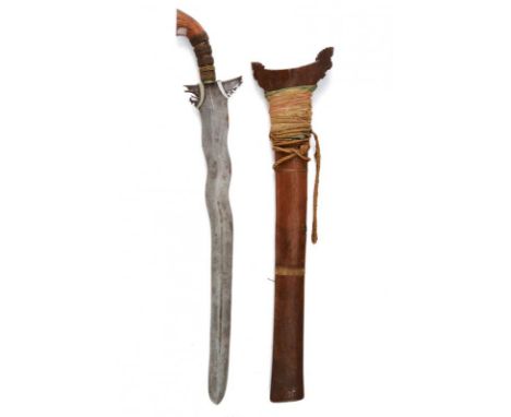 dating: 19th Century provenance: Mindanao, Large, double-edged blade undulated at the first part and then straight; carved an