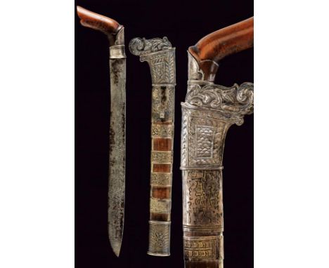 dating: 19th Century provenance: Sulawesi, Straight, single-edged blade, in finest and rare pamor. Angled, wooden, embossed g