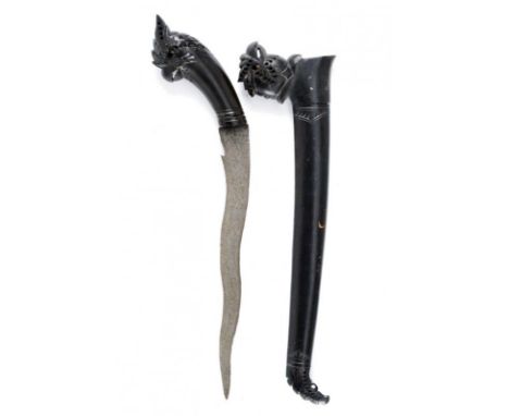 dating: early 20th Century provenance: Sumatra, Flat, undulated, pamor blade with curl at the base. Wooden and iron grip and 