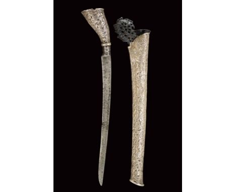 dating: circa 1900 provenance: Sumatra, Single-edged blade. Grip entirely covered with silver inlay, embossed with floral mot