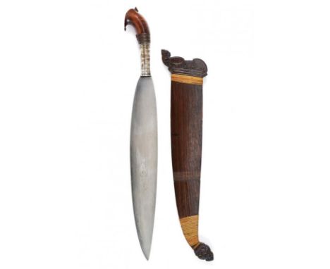 dating: 19th Century provenance: Mindanao, Wide and solid, single-edged blade made of fine pamor. Elegant briarwood grip with
