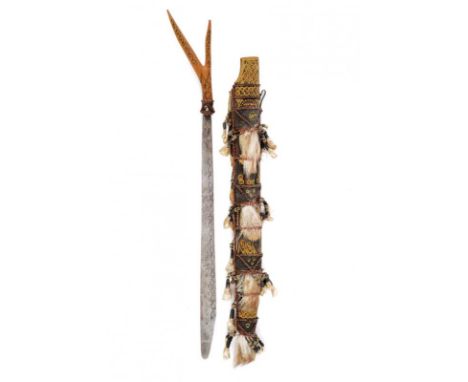 dating: early 20th Century provenance: Borneo, Single-edged blade with rounded tip. Forked hilt made of painted wood. Wooden 
