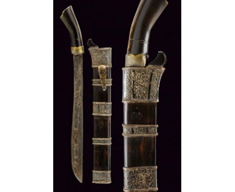 dating: 19th Century provenance: Sumatra, Straight, single-edged blade, in fine pamor. Horn grip with metal ring-nut. Wooden 