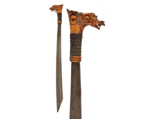 dating: End of 19th beginning of 20th Century provenance: Borneo, Slightly curved, single-edged blade with tang, richly engra