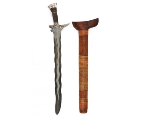 dating:  provenance: The Philippines, Undulated, double-edged blade, with carved, grooved base and two silver bands. Wooden h