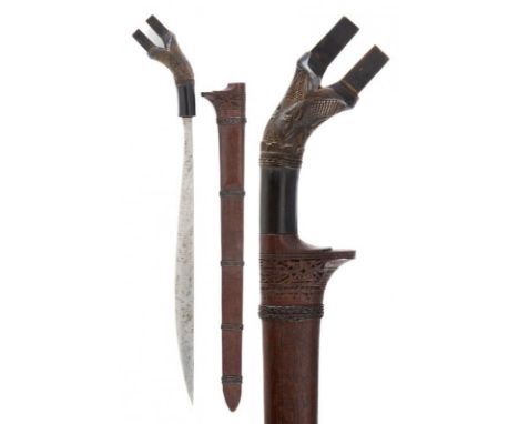 dating: 19th Century provenance: Sumatra, Straight blade with a curved single edge, growing towards the blade. Wooden hilt wi