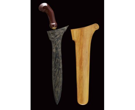 dating: 20th Century provenance: Surakarta, Very large and heavy blade made of fine pamor, with light fuller. Wooden ukiran, 