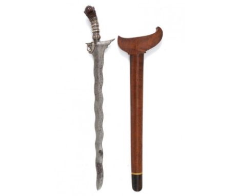 dating: 19th Century provenance: Mindanao, Undulated, double-edged blade made of fine pamor, carved base with a white metal b