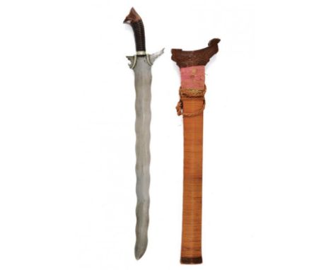 dating: early 20th Century provenance: Mindanao, Undulated, double-edged blade with carved base and two white metal bands. Wo